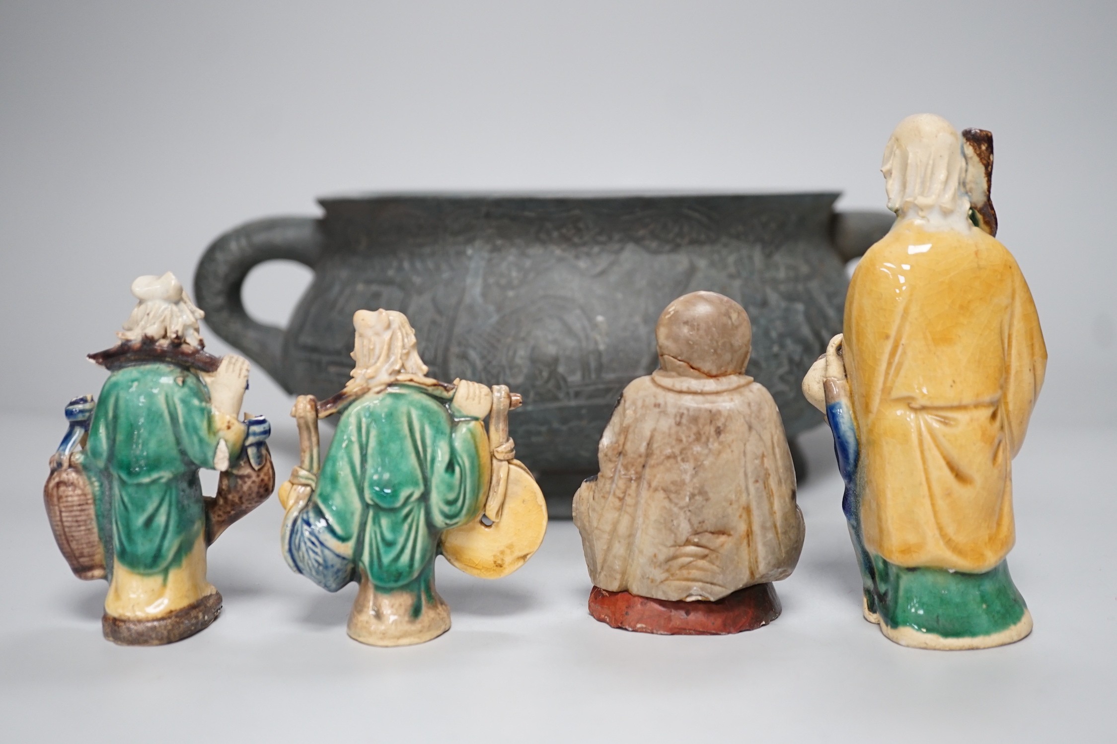 A large late 19th/early 20th century Chinese bronze censer, gui, Xuande mark, together with four Chinese figures. Tallest 12cm